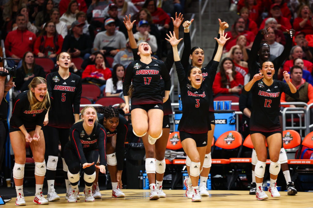 Louisville volleyball players celebrate Thursday's NCAA semifinal game against Pitt.